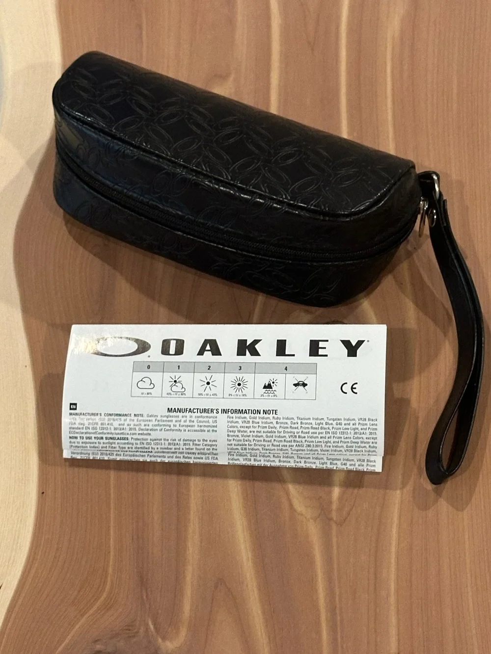 NWT Oakley Black Embossed Soft Sunglasses Case with wrist strap.
